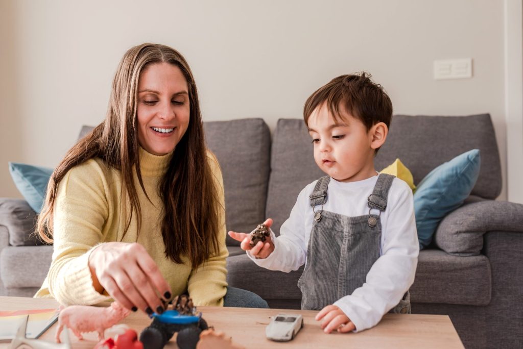 A mother playing with her child with educational toys